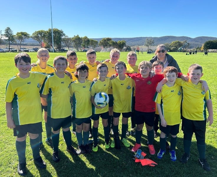 Soccer team with teacher