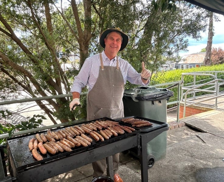 Principal cooking BBQ