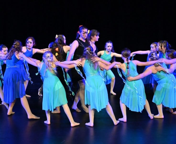 Senior dance group performing in costumes