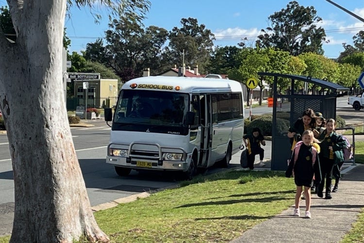School bus with students arriving at school